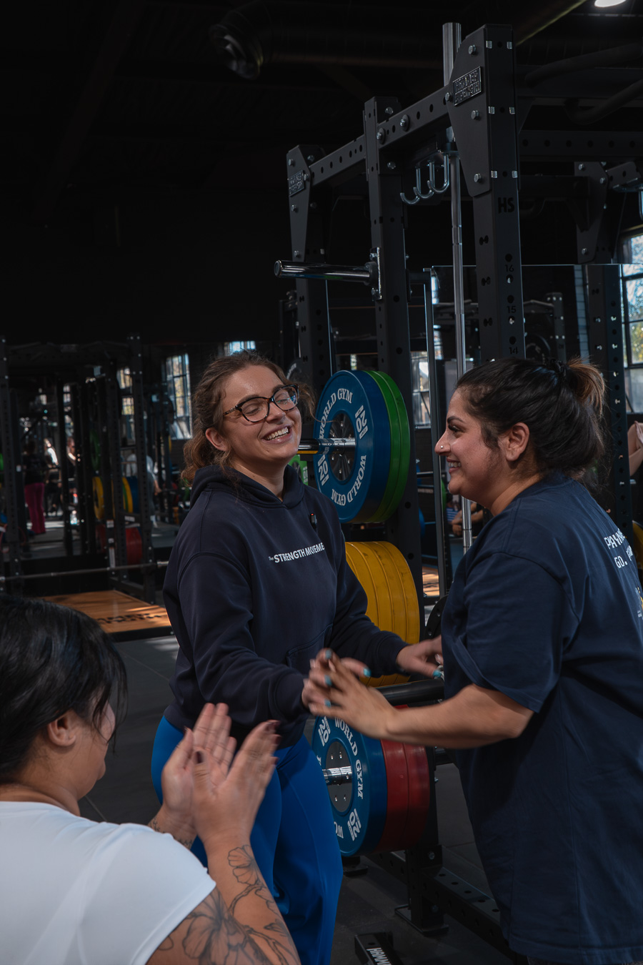 Kim cheering on Lizi by the barbell